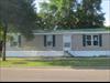 The 2 windows on the right are the living room.  The other 2 windows are in BR 2 and BR 3.