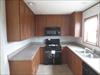 Kitchen.  Look at all the cabinets.  double window over the sink.  Nice.......