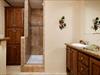 Furniture style vanity with Serenity shower.  Factory picture.