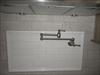 Potfiller faucet.  Fills big kettles on the stove.