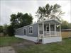 Exterior.  A deck will be built to connect the front door and patio door.
